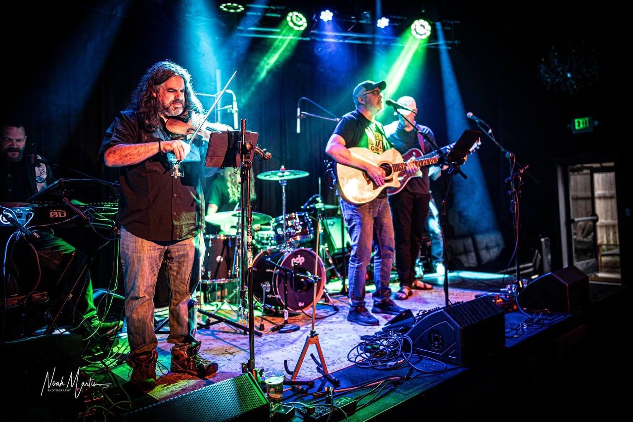 Photo: Noah Martin Photography Full band performing on a club stage